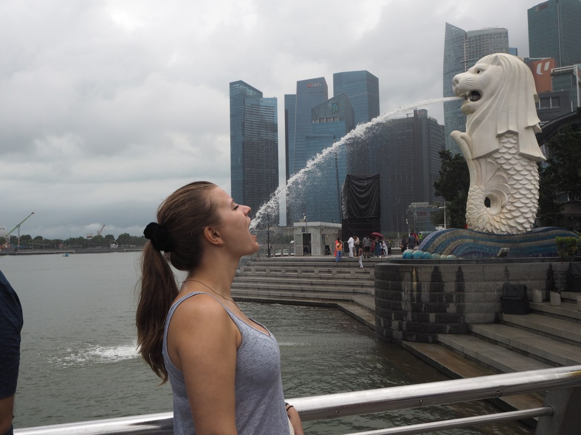 Drinking water out of the Merlion in Singapore